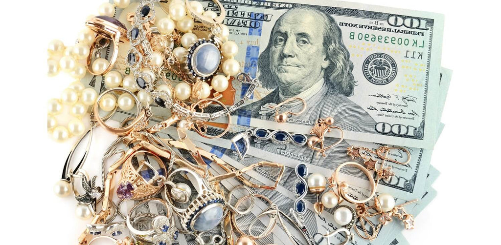 Pile of jewelry and dollar bills